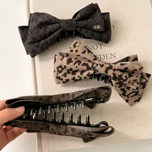 Three leopard print bow banana clips for ponytails in retro grey and brown fabric