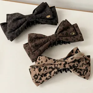 Three-piece set of leopard print bow banana hair clips in black, brown and khaki tones