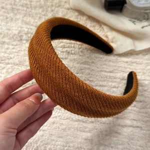 Brown wide knitted headband for women with soft ribbed texture for autumn winter hair styling