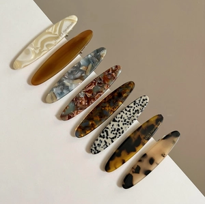 Eight vintage acetate hair clips with diverse marble and tortoiseshell patterns for women