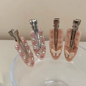 Set di fermagli per capelli in acetato rosa marmorizzato con strass e farfalle
