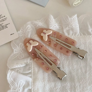 Fermagli per capelli in acetato marmorizzato rosa con farfalla di cristallo e strass