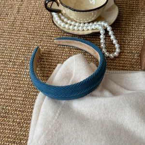 Detailed close-up of dark blue twill knit headband with non-slip velvet inner lining