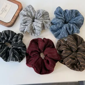 Five-piece set of striped knit scrunchies in gray, blue, black, burgundy, and brown