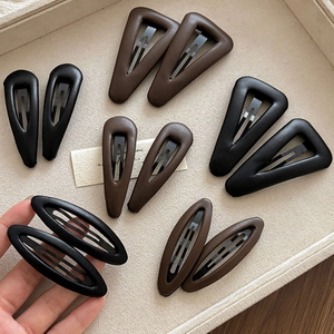 Vintage leather triangle and oval BB hair clips in classic black and dark brown colors