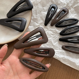 Vintage leather triangle and oval hair clips set in black and dark brown finish