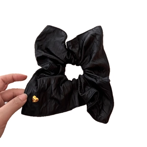 Premium black PU leather scrunchie with a gold heart pendant charm for women