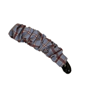 Blue and red plaid fabric banana hair clip with elegant pleated texture on white background