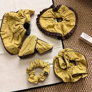 Mustard yellow polka dot hair scrunchie set with large bow claw clip and lace trim