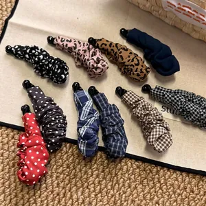 Vintage leopard and polka dot pleated banana hair clips in various patterns and colors