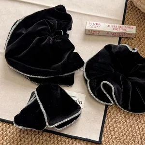 Elegant black velvet bow hair clip set with sparkling rhinestones in French vintage style