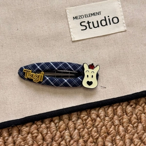 Close-up of Navy Blue Plaid BB Hair Clip with Cartoon Polar Bear and Tagi Lettering