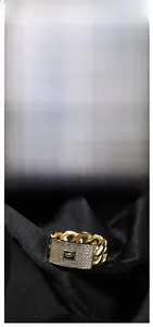 Macro shot of 14K gold-plated chain ring featuring a pavé zircon panel with letter S