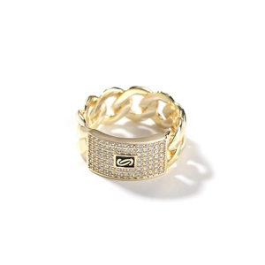 Detail of 14K gold cuban link ring with zircon pave rectangle plate and S logo
