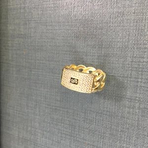 Detail of 14K gold plated rectangular ring with pave zircons and cuban chain band