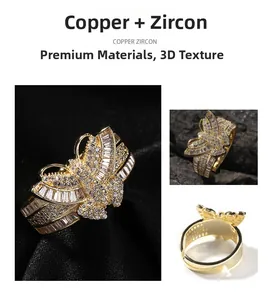 Detail of 3D gold butterfly ring with cubic zirconia stones and adjustable copper band