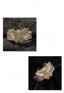 Detailed macro view of 3D gold butterfly ring featuring sparkling cubic zirconia crystals
