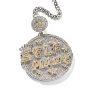 Macro detail of Self Made pendant with iced-out crystals and twisted chain
