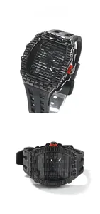 Detail of all-black luxury hip hop watch with square cut crystals and silicone strap
