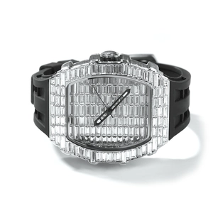 Macro shot of luxury iced-out watch with baguette-cut crystals and black rubber strap