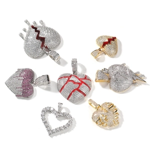 Hip-hop iced out heart pendants with cubic zirconia in silver and gold finishes