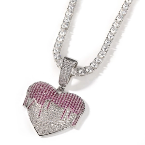 Detail of melting heart pendant with pink and white zircon stones on tennis chain