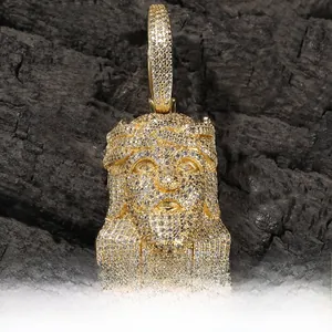 Macro shot of hip hop Jesus head pendant in copper with sparkling zircon stones