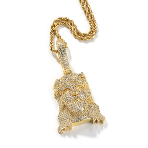 Detail of hip hop Jesus head pendant with cubic zirconia inlay and gold plated rope chain