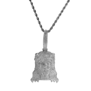 Macro detail of iced out hip hop Jesus pendant with cubic zirconia on rope chain