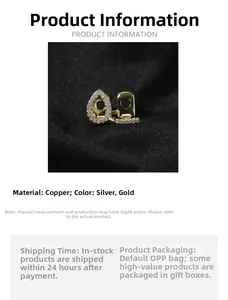 Detail of copper gold-plated hip hop tooth grillz with embedded cubic zirconia diamonds