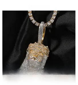 Macro detail of iced-out hip hop Jesus pendant with dual-tone plating and cubic zirconia