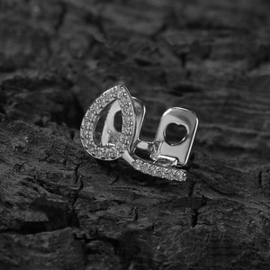 Silver teardrop hip-hop grillz with pavé zircon stones and heart-shaped cutouts