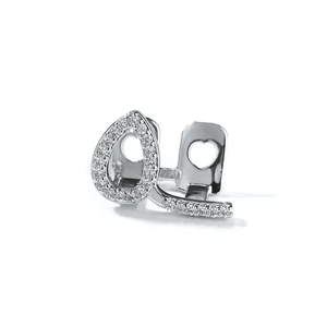 Detailed macro view of silver hollow heart hip hop grillz with sparkling zircons