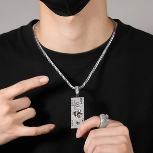 Hip-hop silver tennis chain with dollar pendant and iced out ring on male model