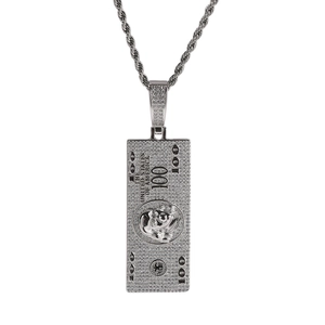 Close-up of hip hop style iced-out copper dollar pendant with sparkling zircon inlays