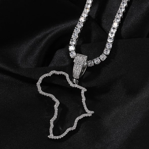 Detailed view of Africa map pendant with cubic zirconia and tennis chain necklace