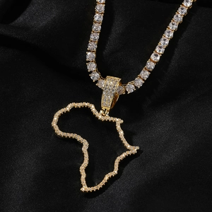 Close-up of hip hop Africa map pendant with micro-pave zircons on a luxury black silk