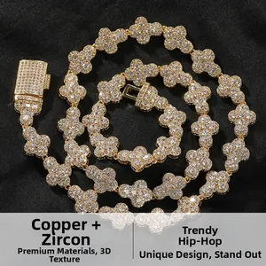 Macro detail of copper and zircon hip-hop necklace with clover-shaped links in gold finish
