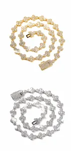 Detailed close-up of gold and silver clover link chains encrusted with cubic zirconia