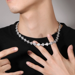Close-up of hip-hop cross-chain necklace with sparkling pavé cubic zirconia on the neck