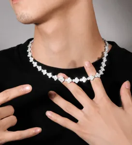 Hip-hop style clover link necklace with sparkling stones worn on a black shirt