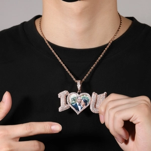 Close-up of rose gold photo locket pendant with I Love You letters and zircon details