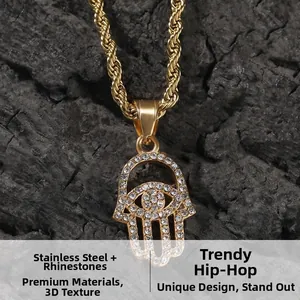 Macro shot of gold-plated Hamsa Hand pendant set with sparkling rhinestones on a twist chain