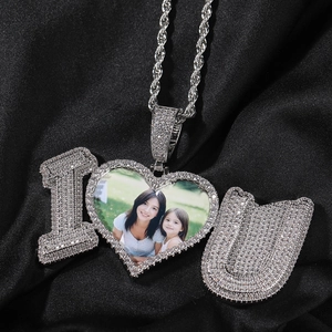 Close-up of heart locket necklace with custom photo and sparkling zircon accents