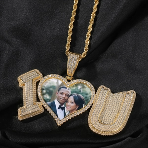 Macro view of gold iced-out necklace pendant featuring I Love You design with custom photo