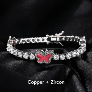Close-up of silver tennis bracelet with white zircons and pink enamel butterfly detail