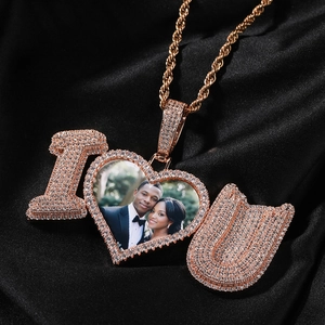 Macro shot of hip hop photo pendant with rose gold plating and zircon I Love You letters
