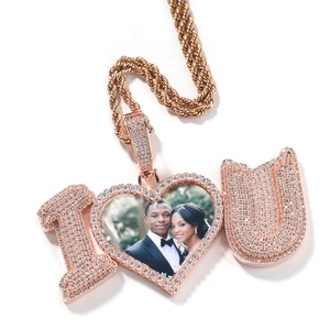 Detailed macro view of the rose gold I Love You photo heart pendant with zircon pavé stones