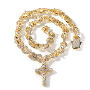 Macro shot of hip-hop cross pendant with micro-pave cubic zirconia on gold infinity chain