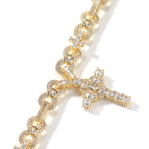 Macro view of gold-plated cross necklace with zircon-encrusted infinity links